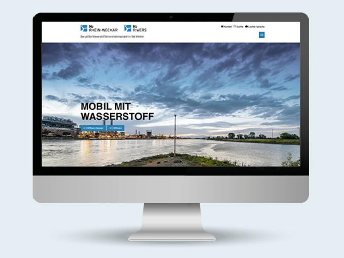 Computerbildschirm zeigt Website von H2 Rhein-Neckar mit Schriftzug: "Mobil mit Wasserstoff".