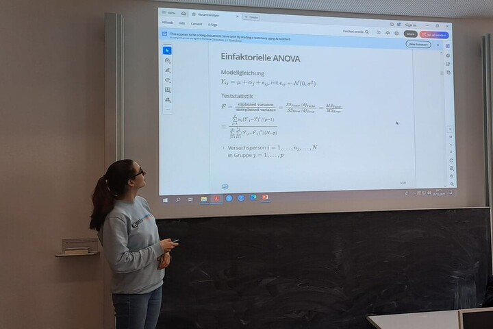 Researcher teaching a statistics seminar