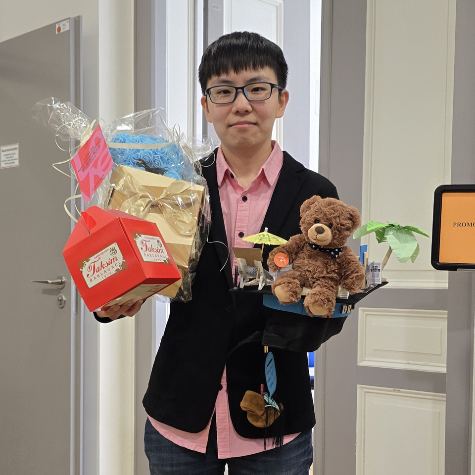 Yumeng with PhD hat Yumeng with PhD hat and gifts.